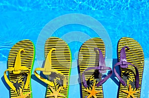 Flip-flops on the swimming pool. photo