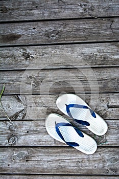 flip-flops on the wooden boards background