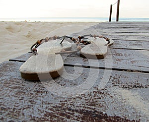 Flip flops on a tropical beach.