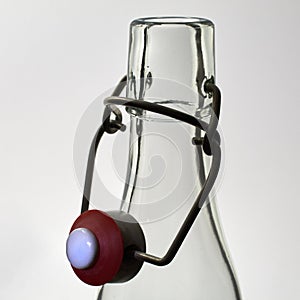 Flip-top bottle made of glass