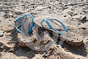 Flipflop sandals on the beach in a sand, travelling and resort concept