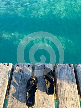 Flipflops with crystal sea on background