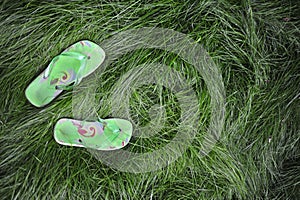 Flipflops in the grass photo