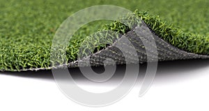 Flipped Up Section of Artificial Turf Grass On White Background