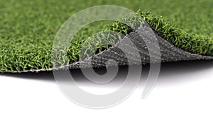 Flipped Up Section of Artificial Turf Grass On White Background photo
