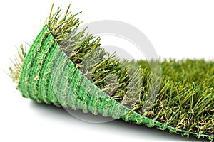 Flipped Up Section of Artificial Turf Grass On White Background photo