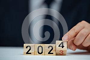 Flipping of 2023 to 2024 on flip block for preparation new year change and start new business target strategy concept