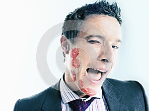 Flirtatious Businessman With Lipstick Kiss Marks photo