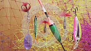 Float and baits on a fishing net background