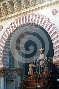 Semana Santa pasos leaving the Mezquita in Cordoba, Spain. photo