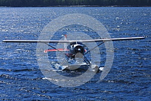 Float plane in blue ocean water