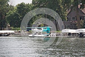A Float Plane at a Dock on a Lake
