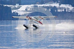 Float plane lands in Saanich Inlet in the winter