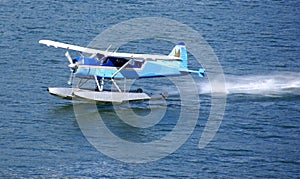 Float plane, taking off from water