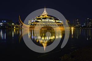 Floating Barge Karaweik Hall on Kandawgyi lake at twilight