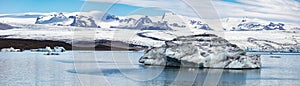 Floating of blue icebergs in Jokulsarlon Glacier Lagoon. Cold morning panorama of Vatnajokull National Park. Picturesque scene of