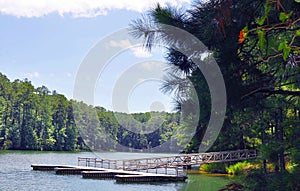 Floating boat slips and dock on a picturesque lake photo