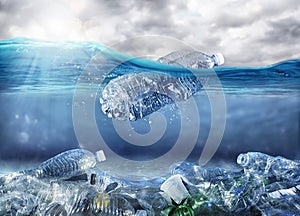 Floating bottle. Problem of plastic pollution under the sea concept