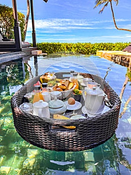 Floating breakfast in pool in Lamai beach resort in Koh Samui, Thailand