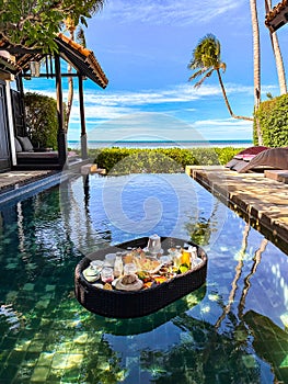 Floating breakfast in pool in Lamai beach resort in Koh Samui, Thailand