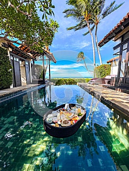 Floating breakfast in pool in Lamai beach resort in Koh Samui, Thailand