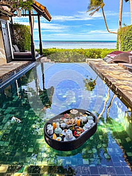 Floating breakfast in pool in Lamai beach resort in Koh Samui, Thailand