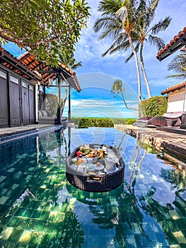 Floating breakfast in pool in Lamai beach resort in Koh Samui, Thailand