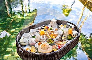 Floating breakfast in pool in Lamai beach resort in Koh Samui, Thailand