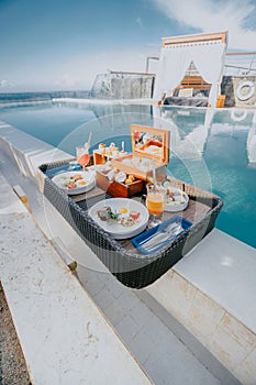 Floating Breakfast Tray at luxury swimming pool hotel.