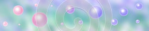 a floating bubble sphere orbs in pastel colors illustration over an ocean sea distance blur banner