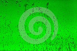 Floating bubbles in green liquid background texture.