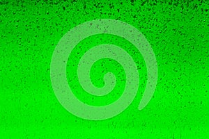 Floating bubbles in green liquid background texture.