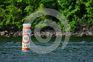 Floating buoy warns boats to go slow, with no wake