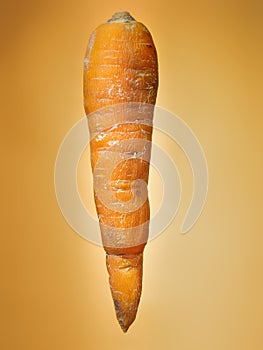 Floating carrot on orange background