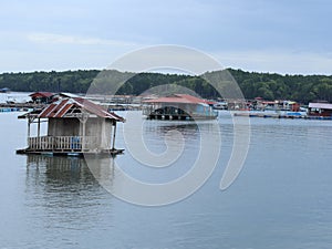 floating chalet and fish farm on the river