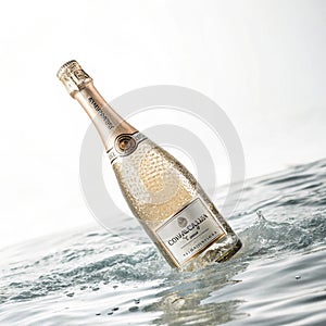 Floating champagne bottle isolated photo