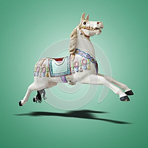 Floating classic carousel horse on green gradient