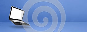 Floating computer laptop isolated on blue. Horizontal banner background