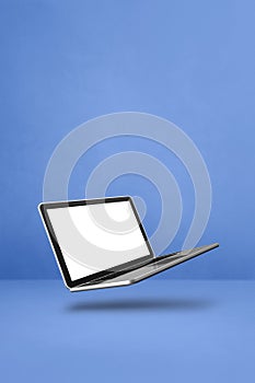 Floating computer laptop isolated on blue. Vertical background