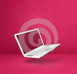 Floating computer laptop isolated on pink. Square background