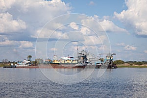 Floating construction from old ships on river