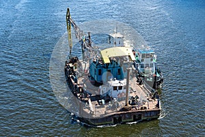 Floating crane and river tug