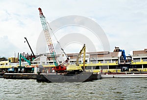 Floating dredging platform on the river