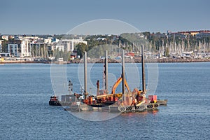 Floating dredging platform on the sea