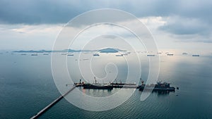 Floating drilling platform on the ocean at evening in rainy season aerial view