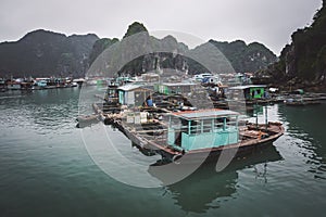 a floating fisherman\'s village in ha long bay, northern vietnam
