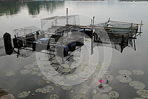 Floating fishpen or fish cage in Sampaloc Lake in San Pablo City, Laguna, Philippines. photo