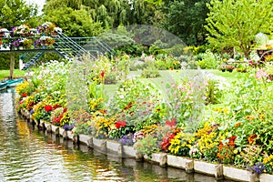 Floating gardens very flowery in the spring between the canals, Hortillonnages in Amiens in France