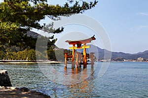 Floating gate of Itsukushima Shrine in Miyajima, Hiroshima, Japan. Travel Asia.