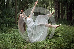 Floating Girl in Forest photo